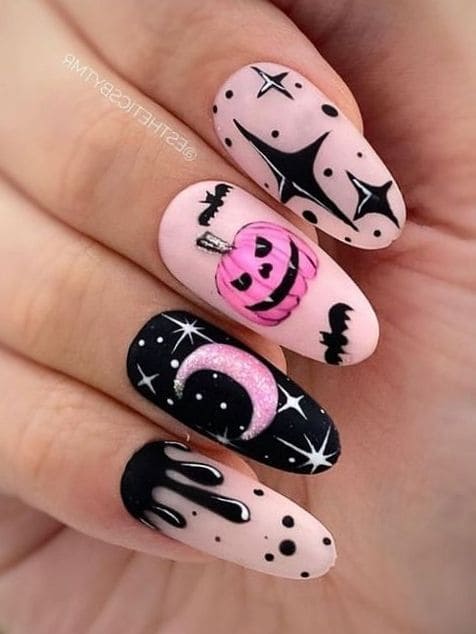 Halloween acrylic nails in black and pink