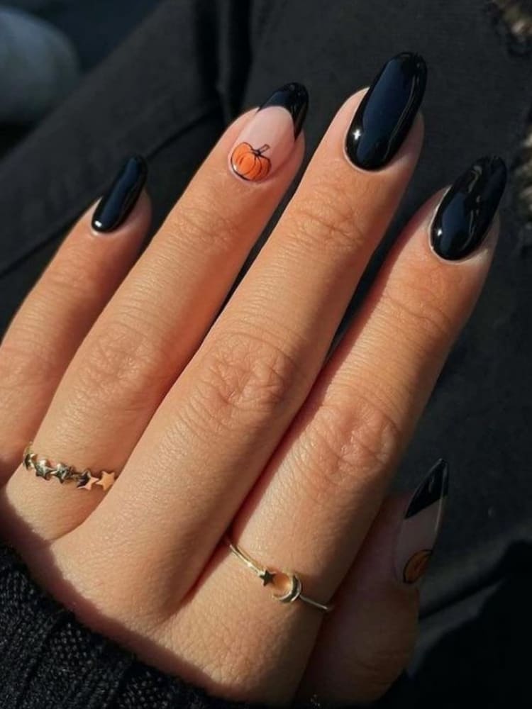 short black nails with a pumpkin accent