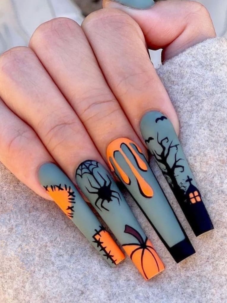 Long Halloween acrylic nails with a haunted house design