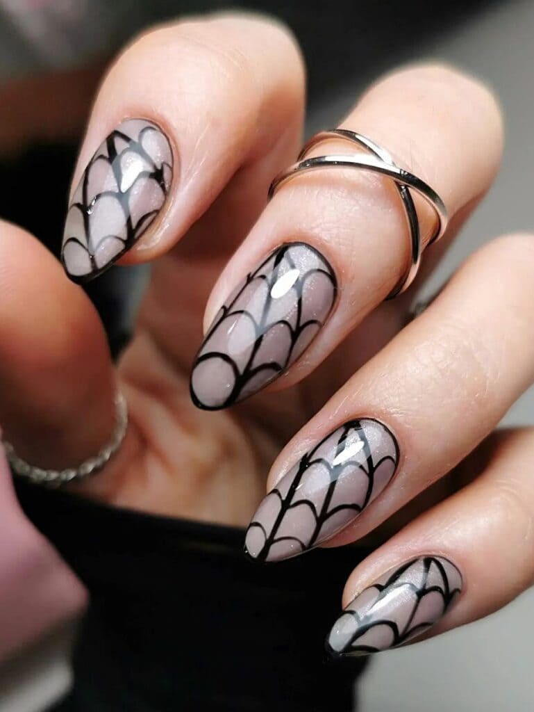 Almond-shaped spiderweb nail design
