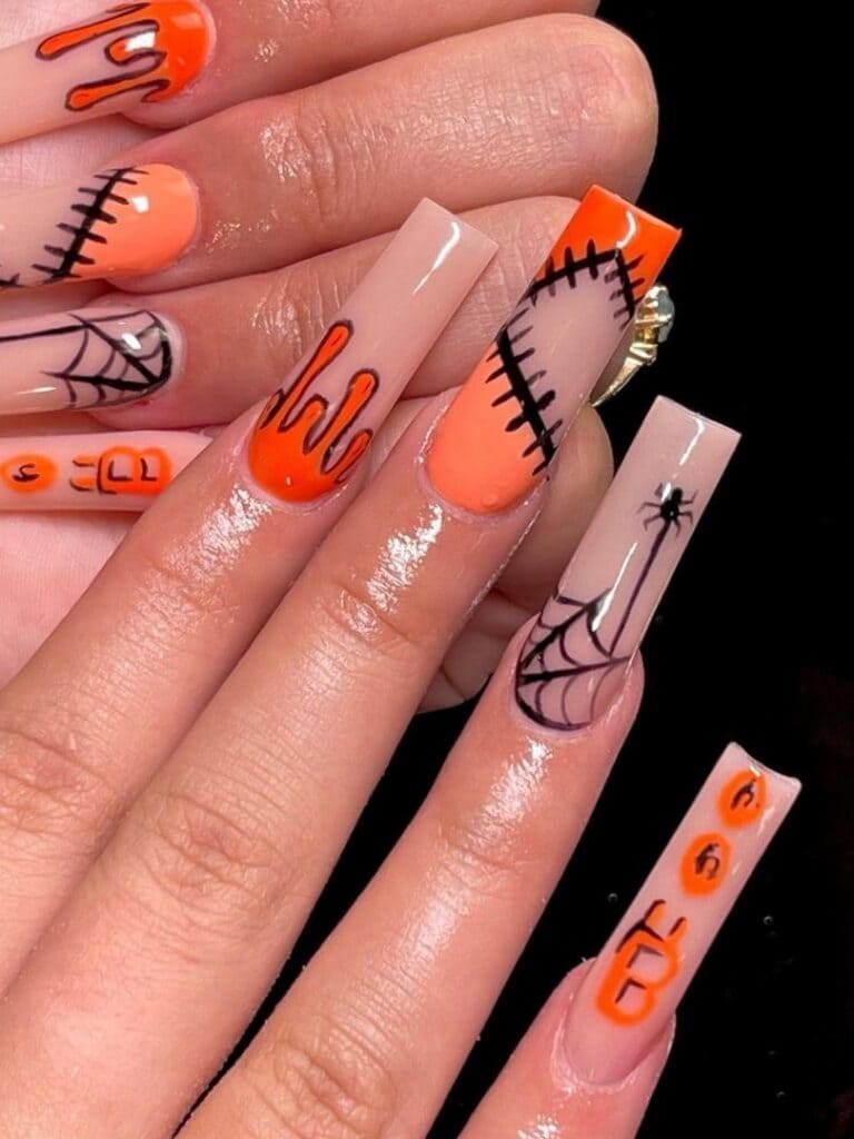 Long Halloween acrylic nails in orange 