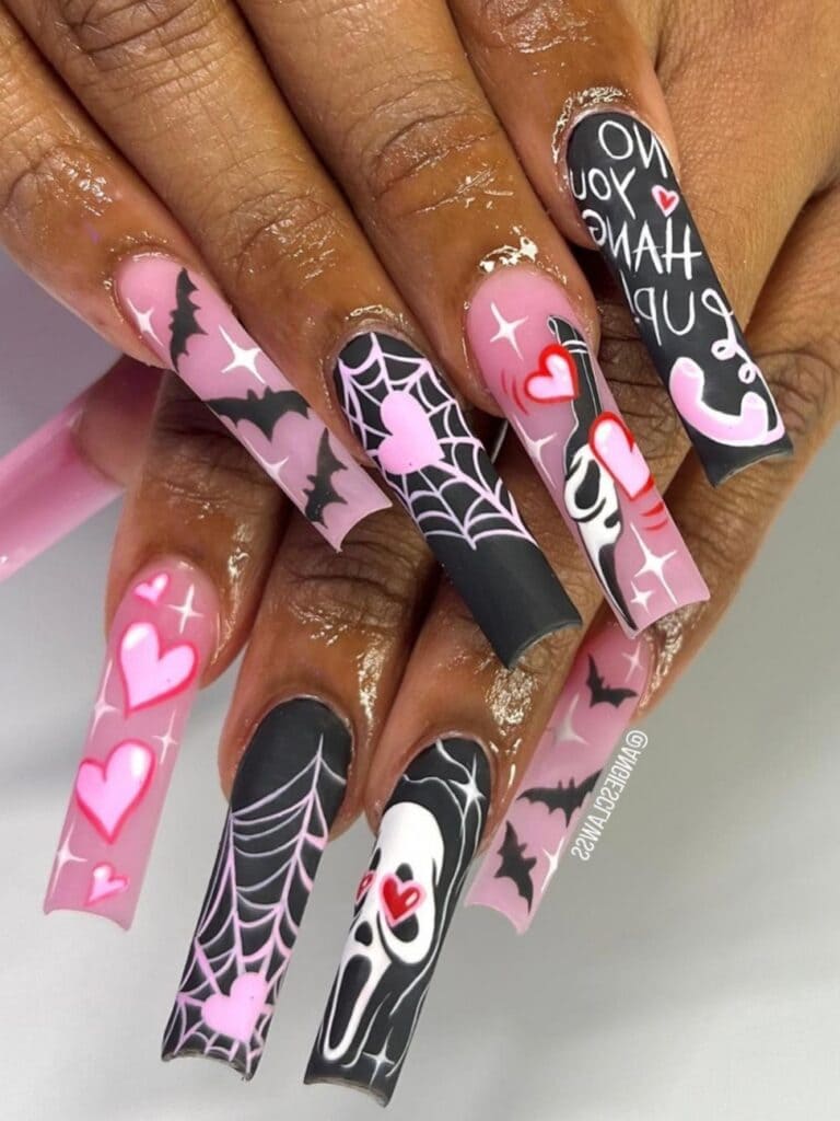 Long Halloween acrylic nails in black and pink
