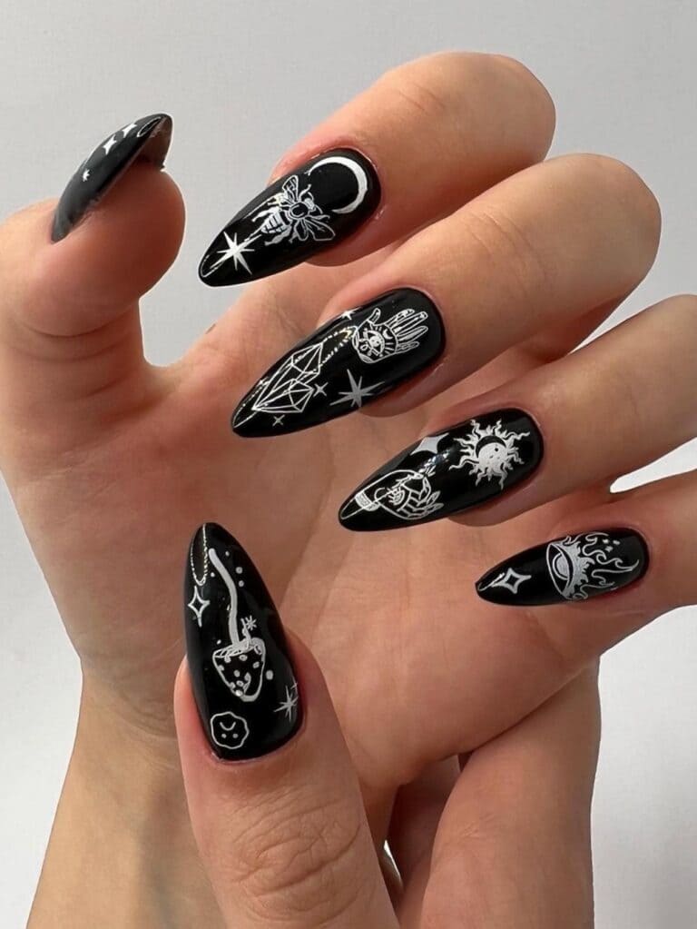 Black stiletto nails with goth design