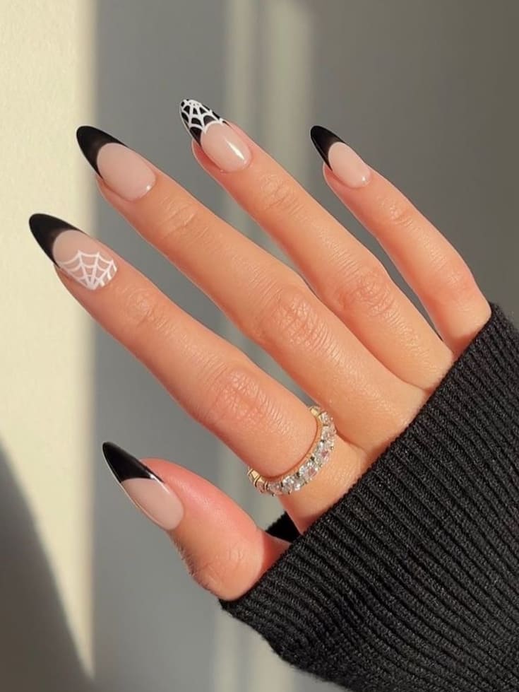 Black French manicure with spiderwebs