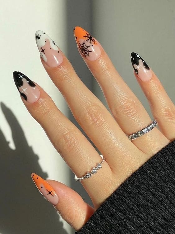 Black, orange, and white astrology nails 