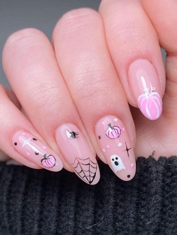 Round-shaped nude nails with pink pumpkins
