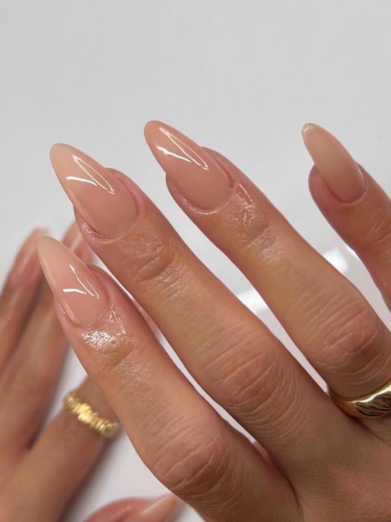 Glossy beige almond-shaped nail design 