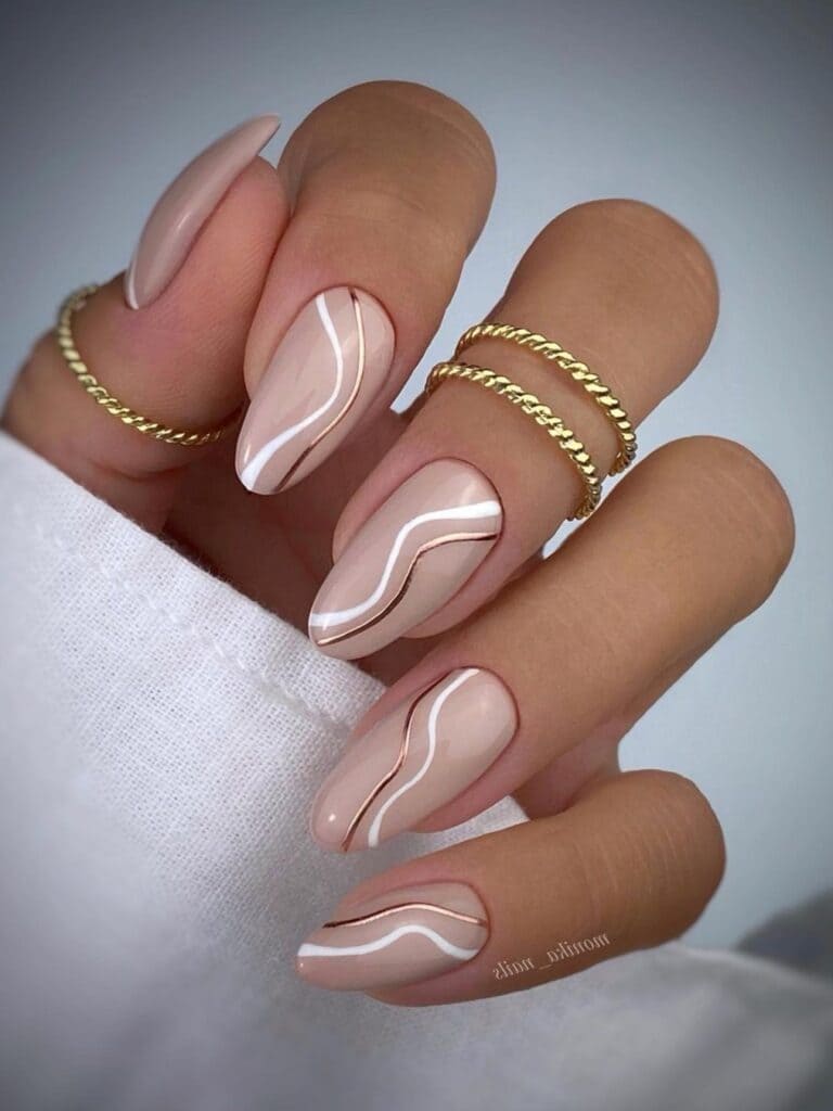 Beige nails with swirl design