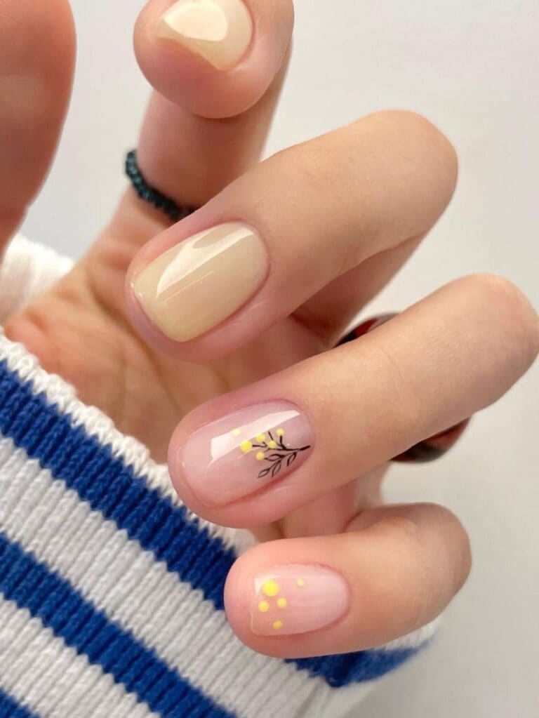 Milky beige short nails with forsythias