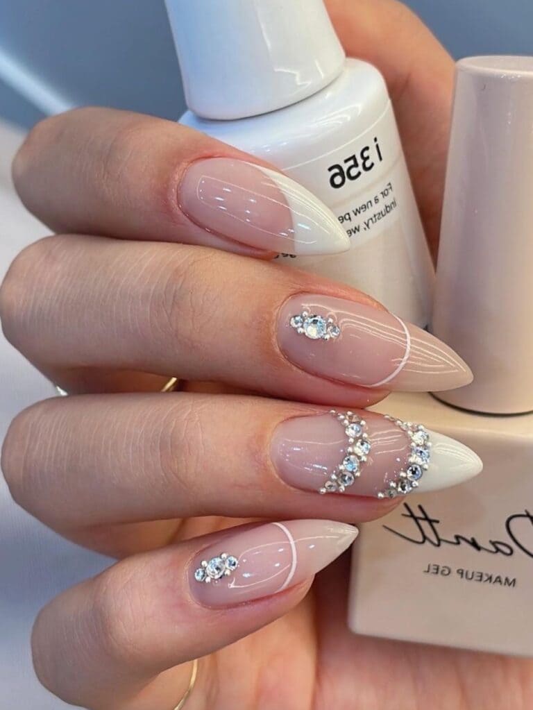 White and beige French tips with gems