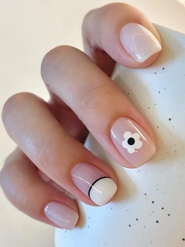 Milky short nails with negative space and flower design