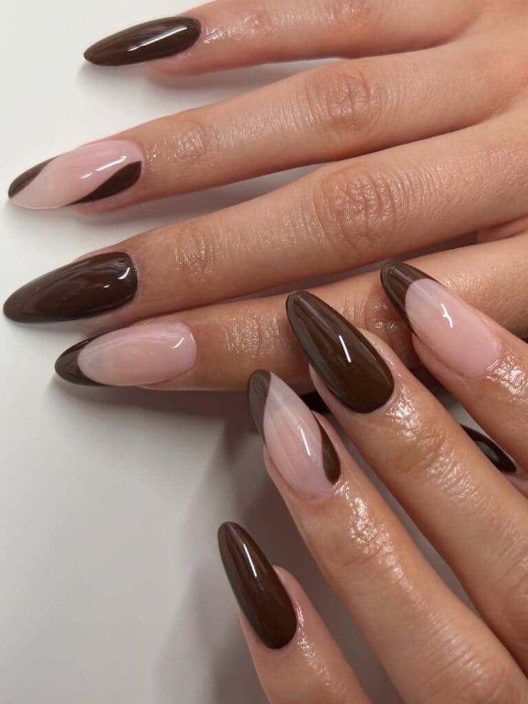Almond-shaped, dark brown nails with negative space 