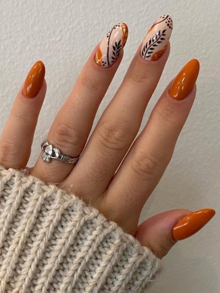 Burnt orange nails with autumn leaves