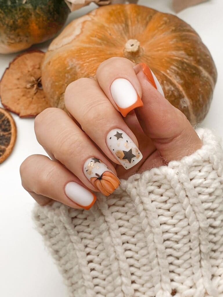 Burnt orange French manicure with pumpkins