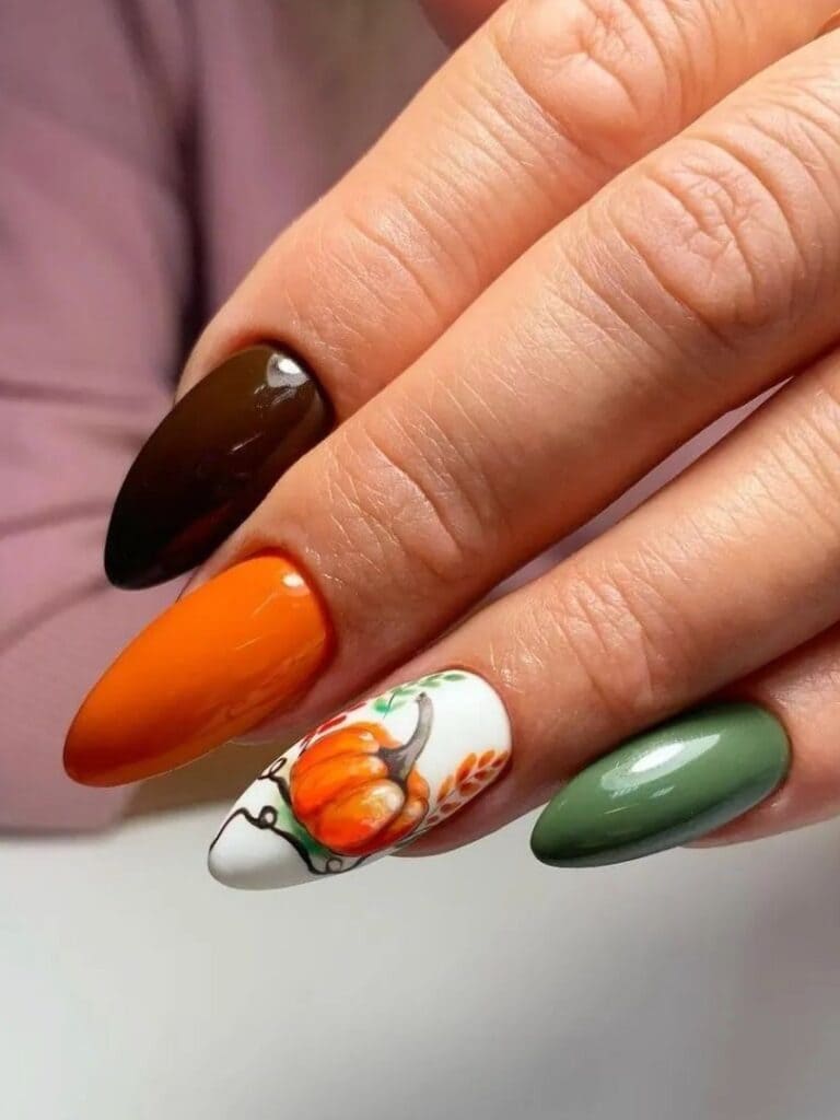 Fall shades of nails with a pumpkin