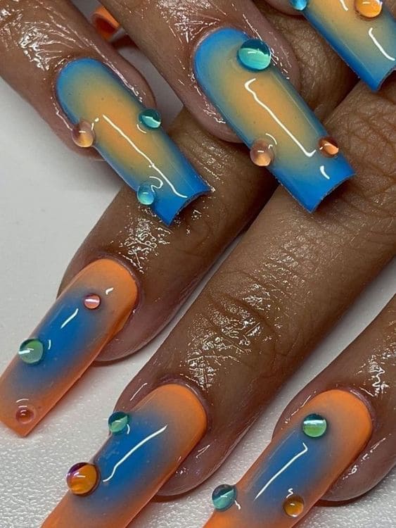 Peach and blue aura nails with 3D jelly dots
