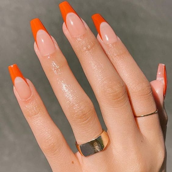 Coffin-shaped orange French manicure