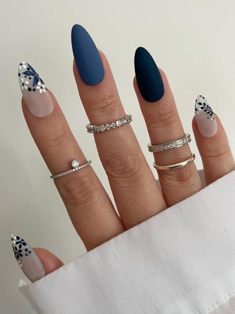 Two-tone, matte blue nails with flowers