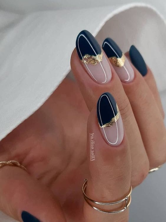 Half-dip navy and gold foil nails 