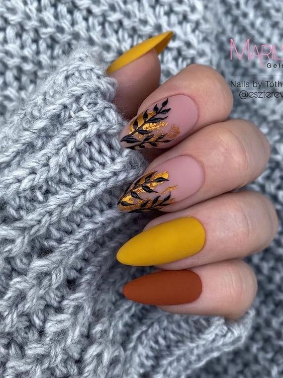 Matte brown and mustard fall nails with leaf designs