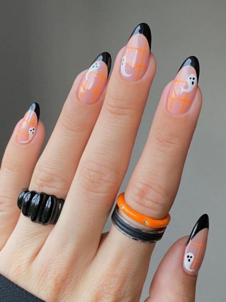 black french manicure with orange plaid and ghosts