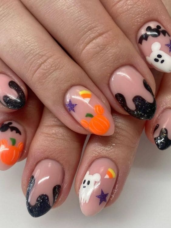 Short nude nails with mix-and-match Disney Halloween design