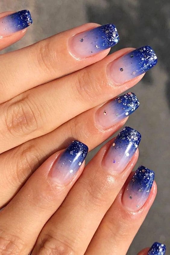 Royal blue gradient nails with glitter