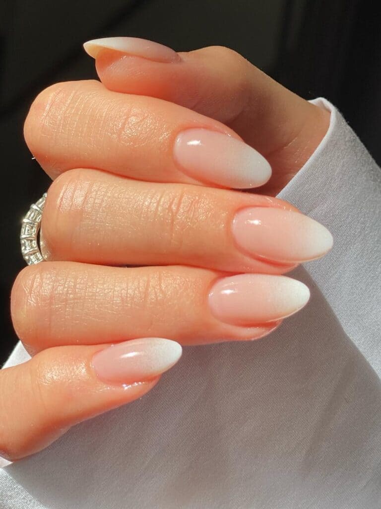 Almond shaped nude and white ombre nails 