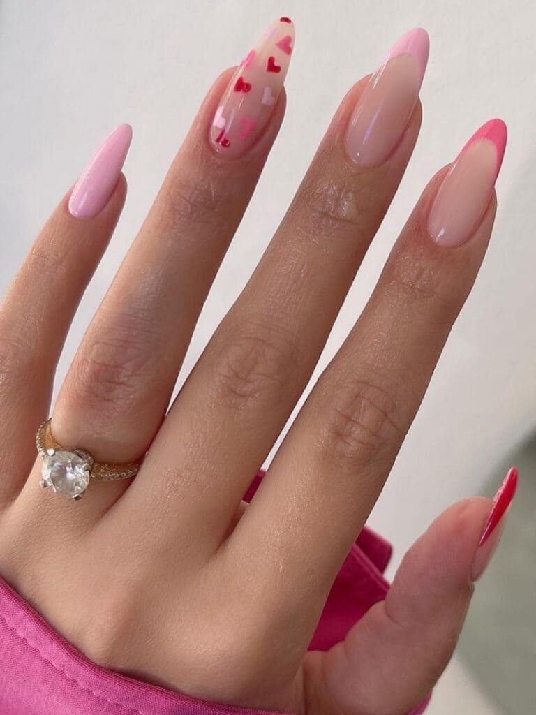 Two-tone pink French tips with tiny hearts