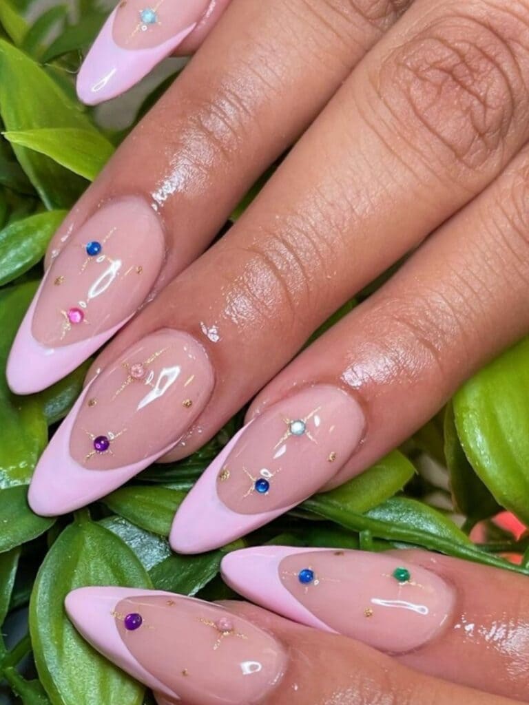 Pale pink tips with colorful rhinestones