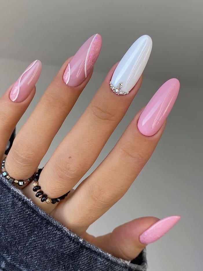 Pink and pearl manicure with rhinestone accent