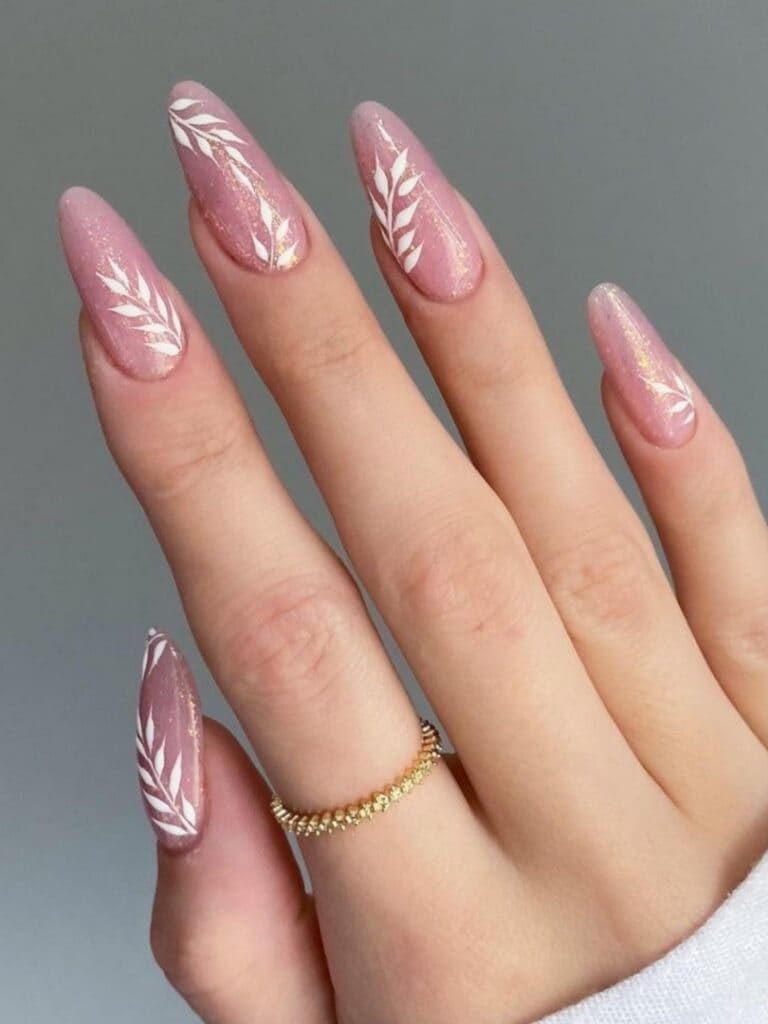 Shimmery pink manicure with leaves