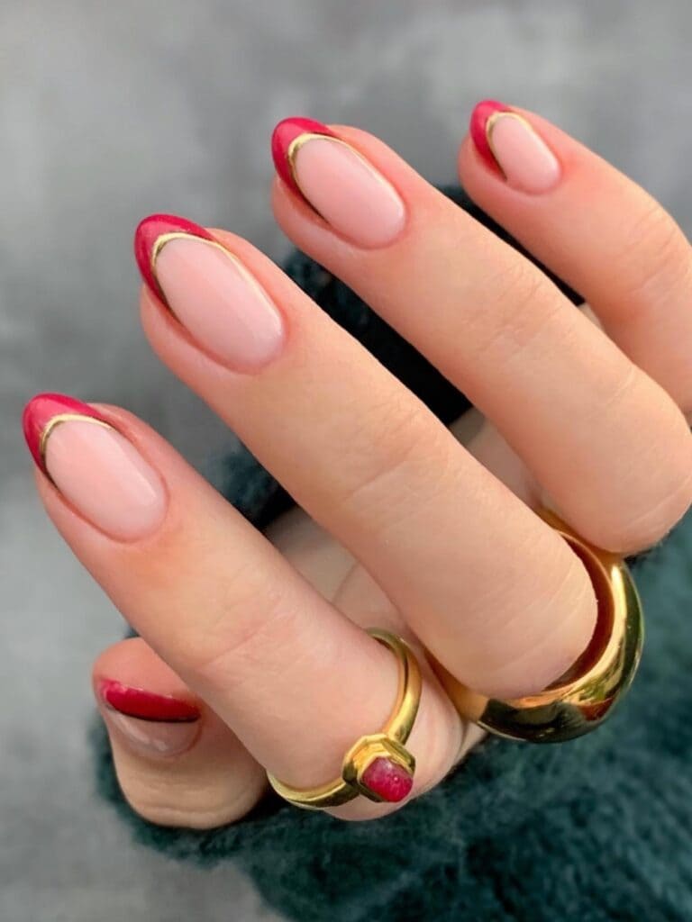 Red and gold double French tip nails