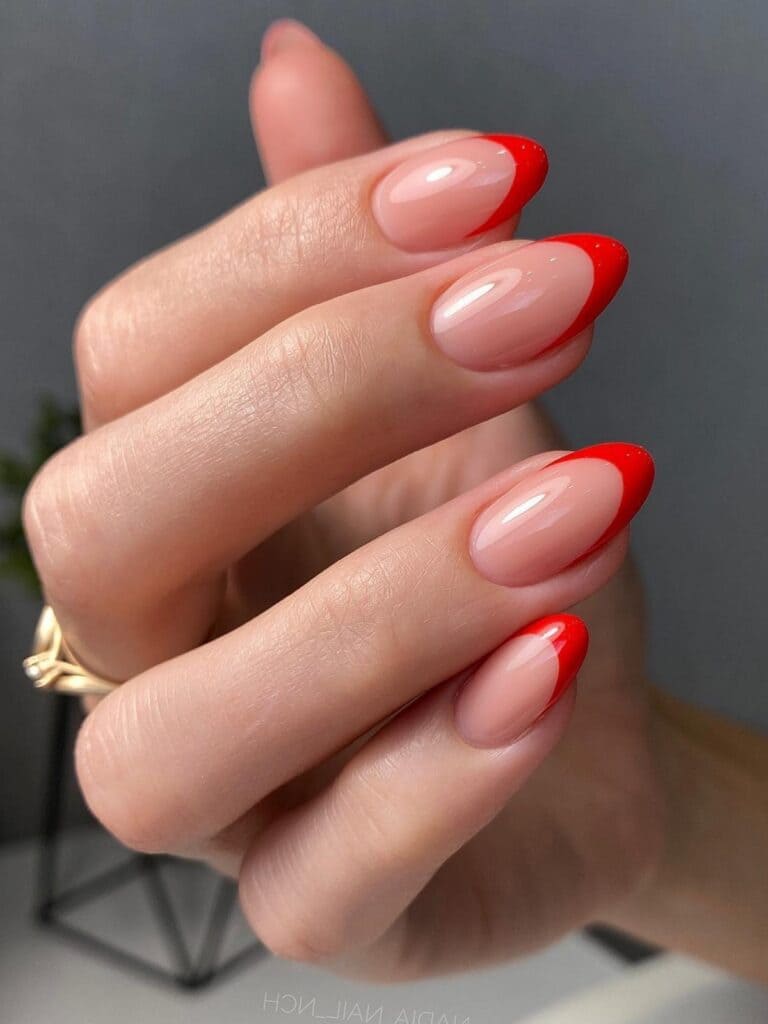 Round-shaped, red French-tip nails