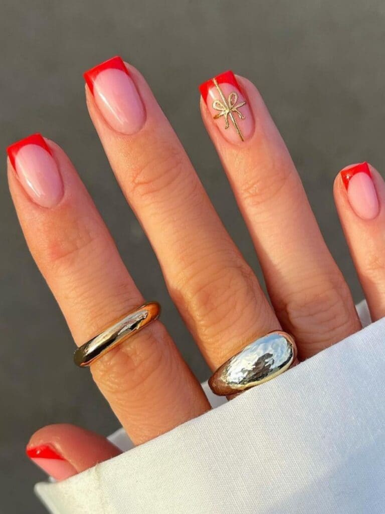 short red French manicure with gold gift design