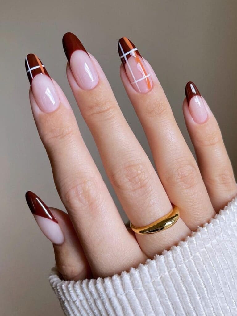 Burgundy French manicure with plaid
