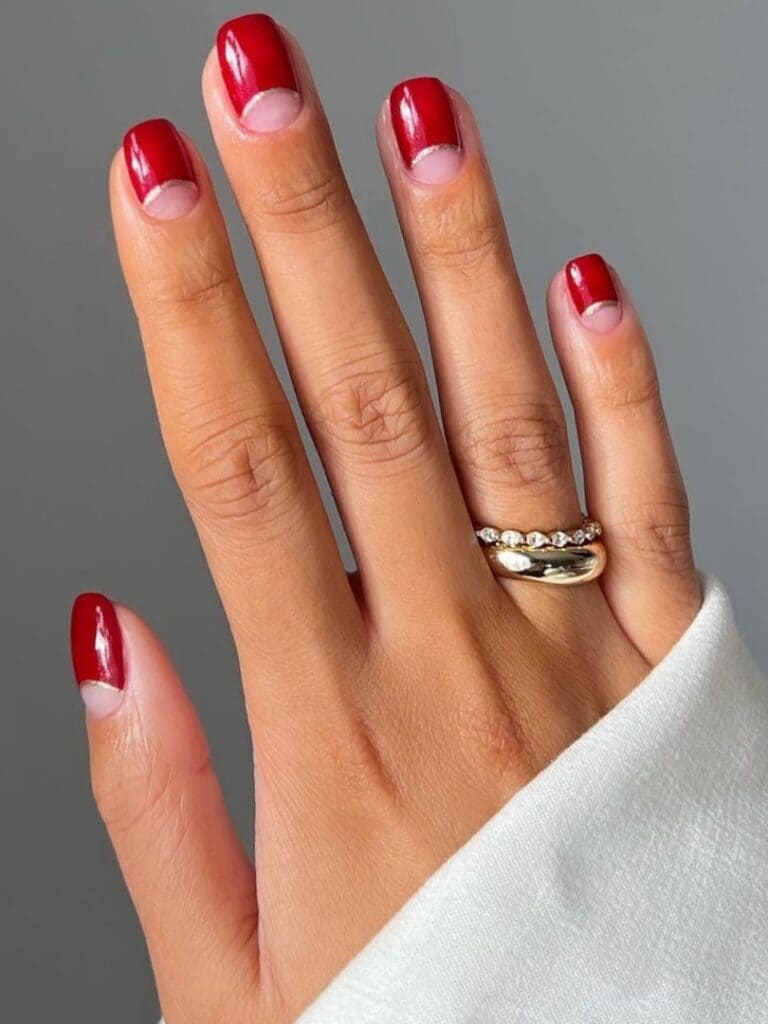 Half-moon negative-space red nails
