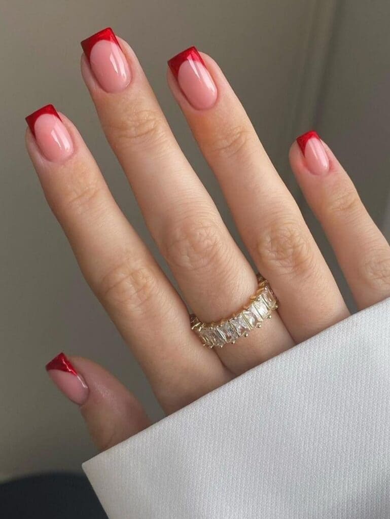 Short, velvety red French tip nails