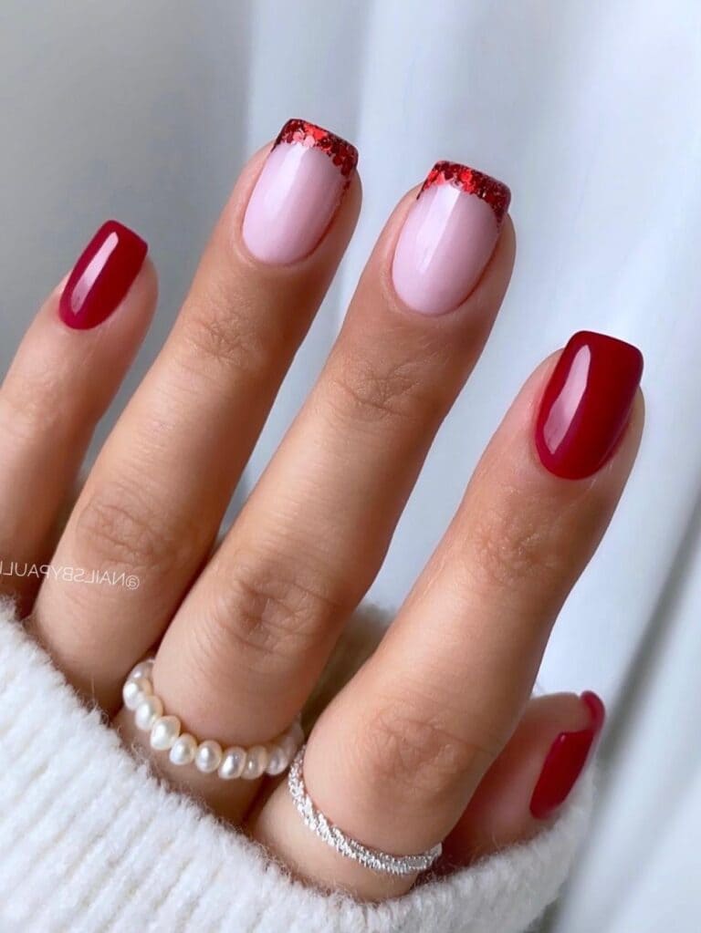 Glossy red short nails with glittery red French tips