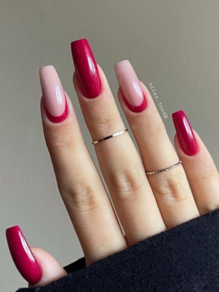 Dark red coffins with reverse French tips