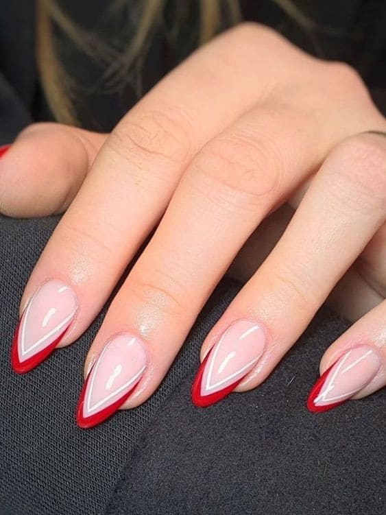 Red and white double chevron tips on an almond shape