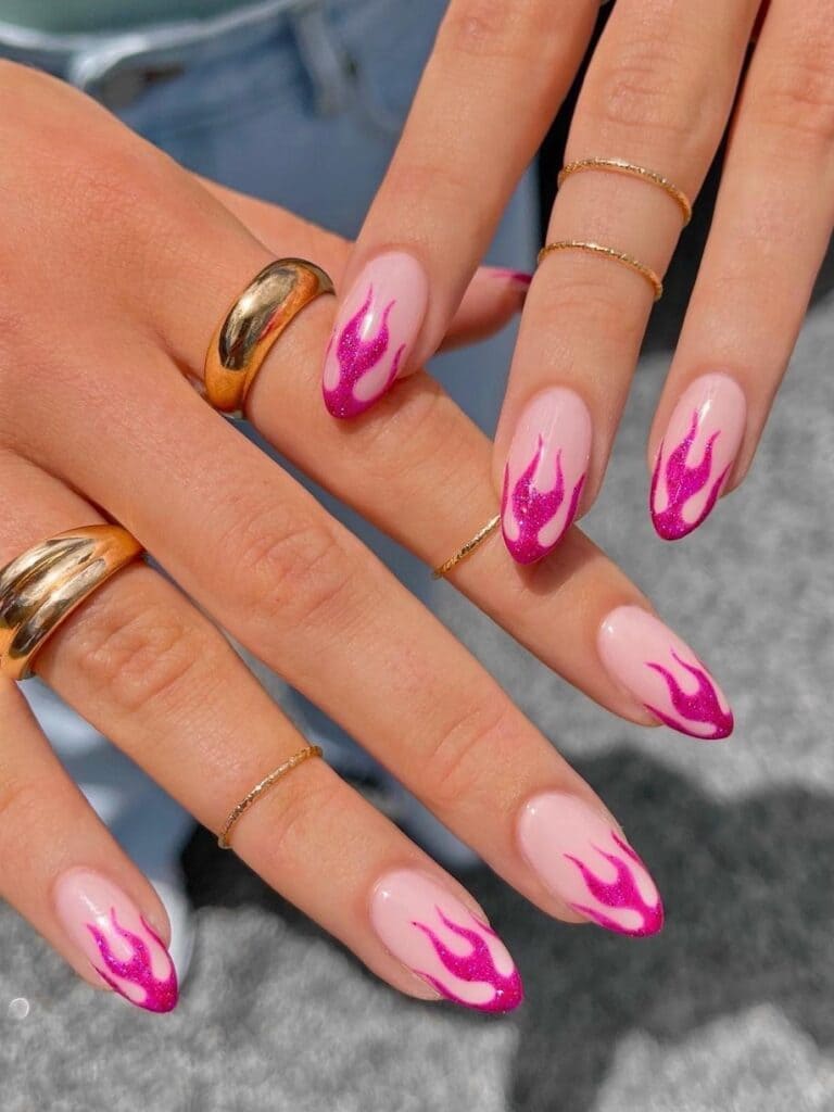 Short, shimmery, hot pink flame nails
