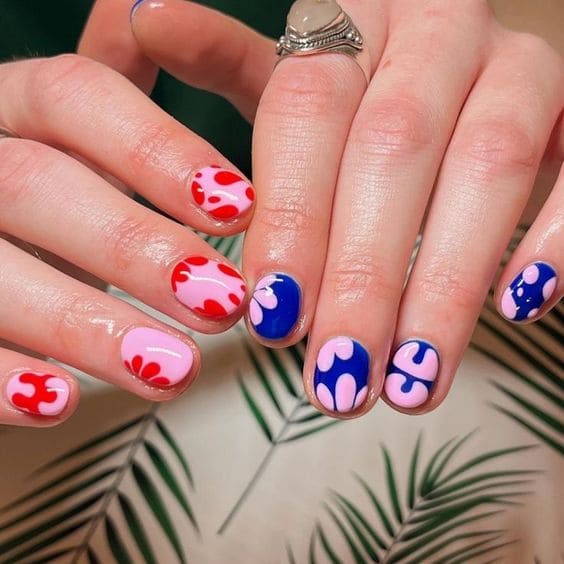 blue and red abstract nail design