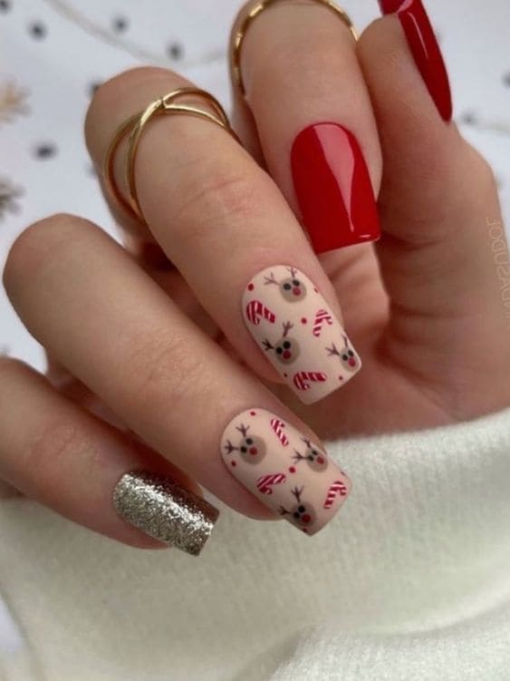 Red and gold Christmas acrylic nails with Rudolph print