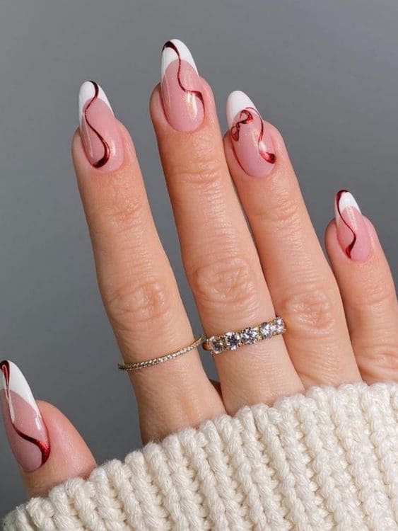 White French tips with floating red ribbon tape