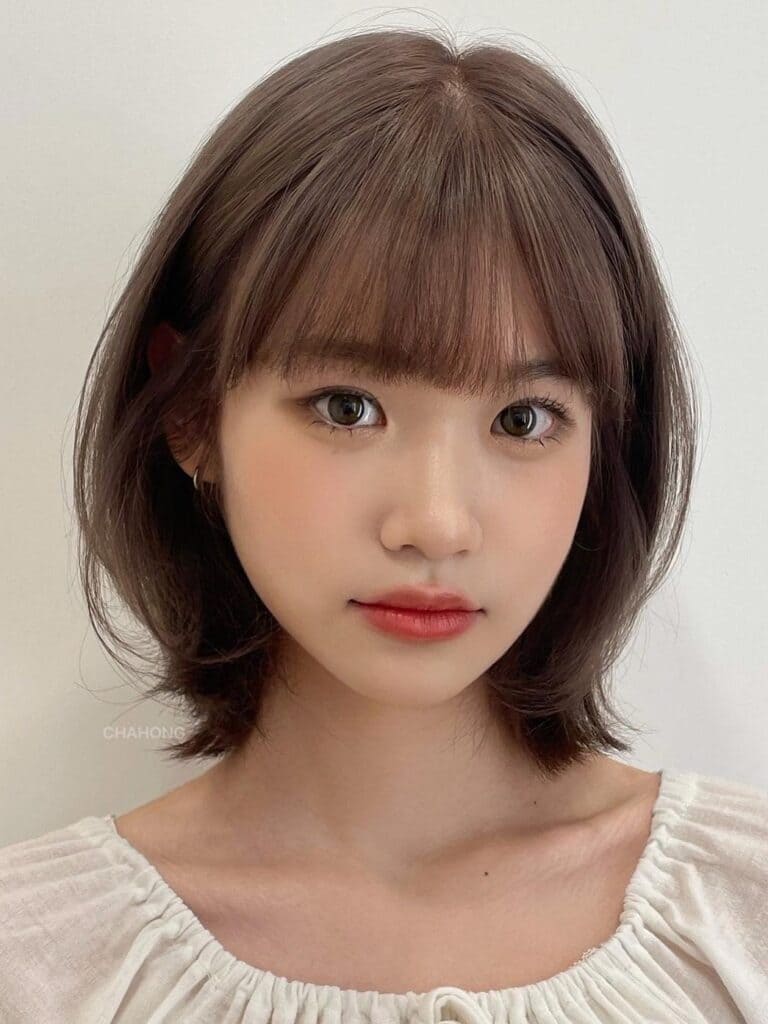c-curled lob with bangs