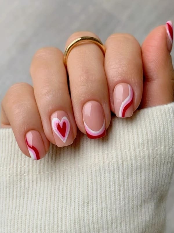 red and pink swirls and cute heart nails