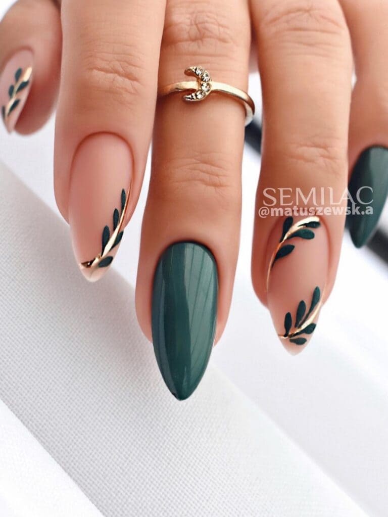 Almond-shaped emerald green nails with 3D leaves