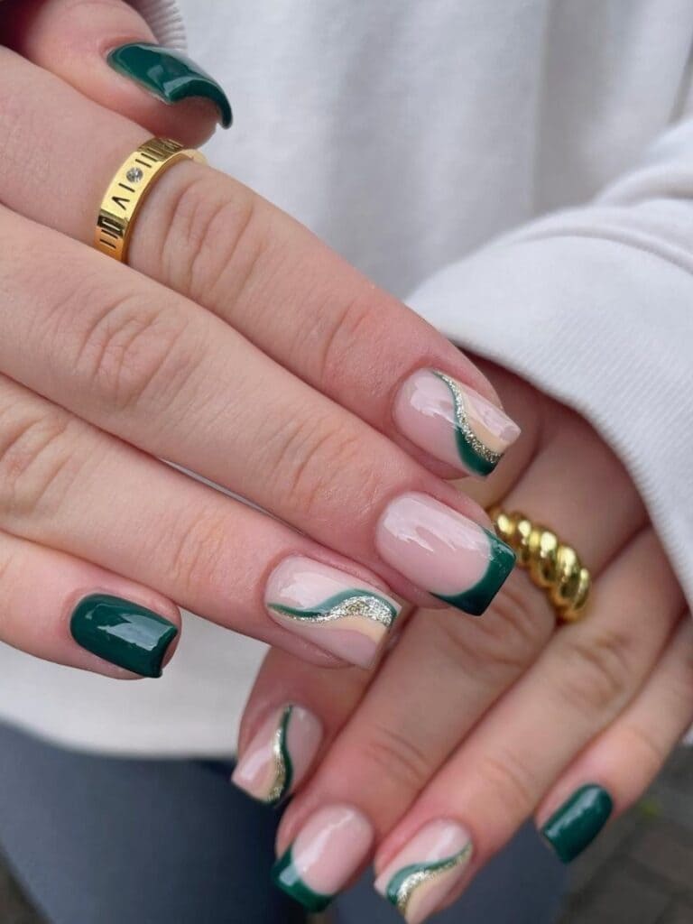 Short emerald green nails with swirls