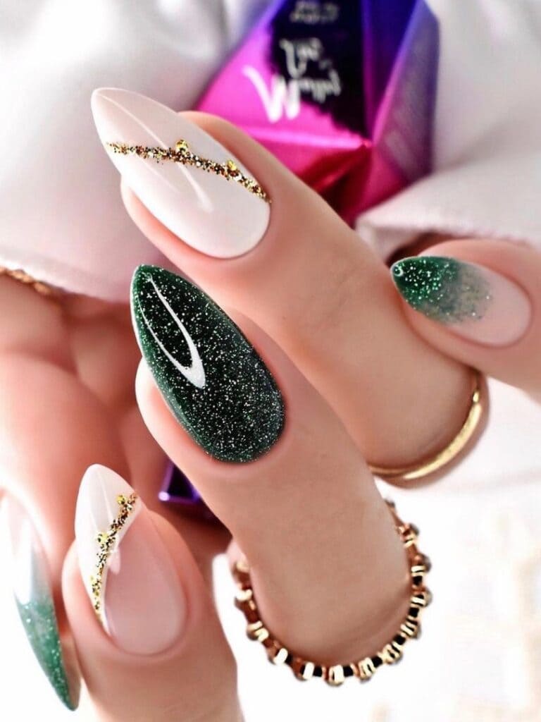 Almond-shaped, glittery emerald green and white nails